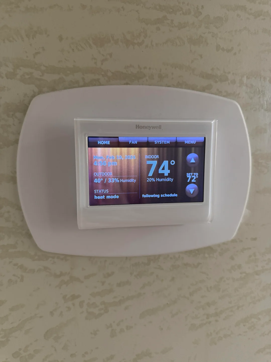 a honeywell thermostat on the wall